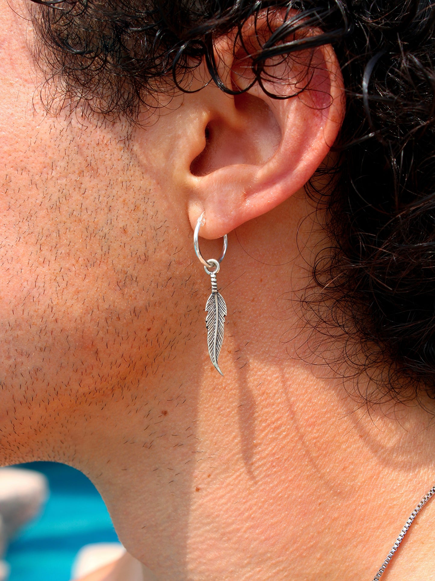 Arete Pluma Hombre